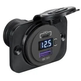 Digital voltmeter/ammeter and power outlets with recessed installation.